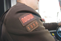 Photograph of Muni operator that shows Muni logo and operator number on sleeve of uniform.